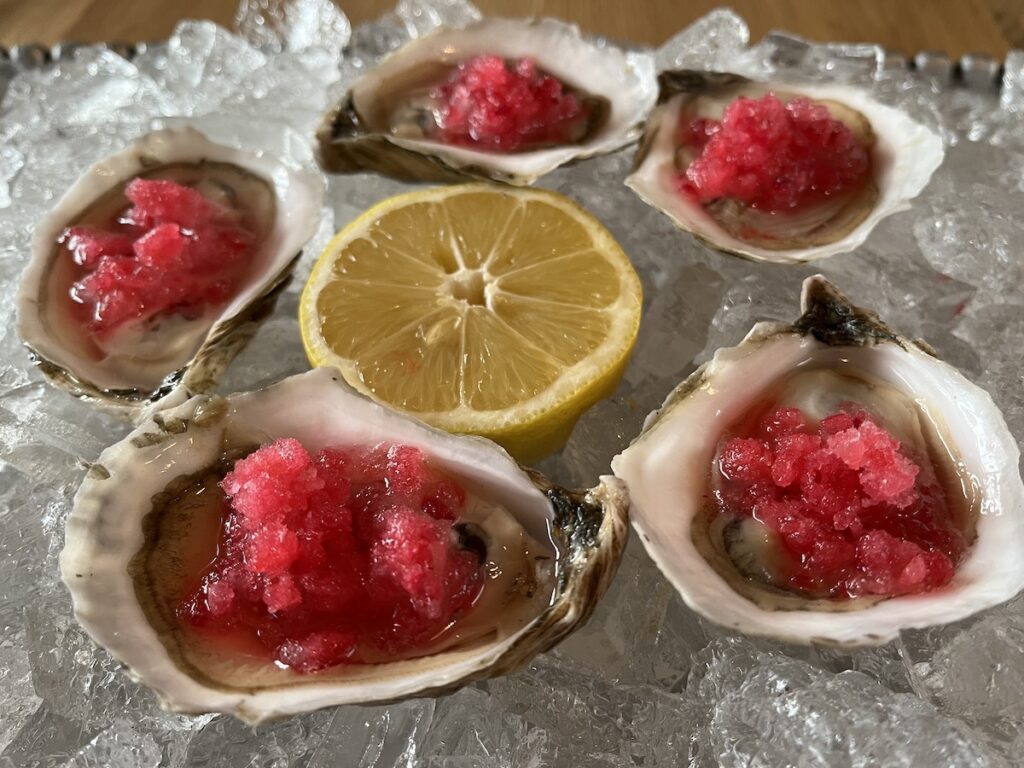 photo of fresh plated oysters with Cranberry Lemon Ice sauce